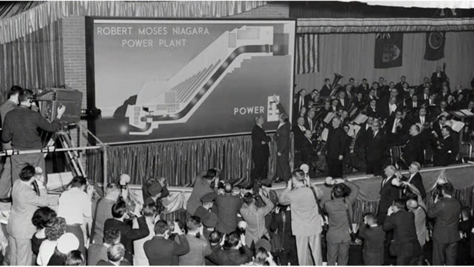 Scene of officials and a large diagram at the opening of the Niagara Power Project